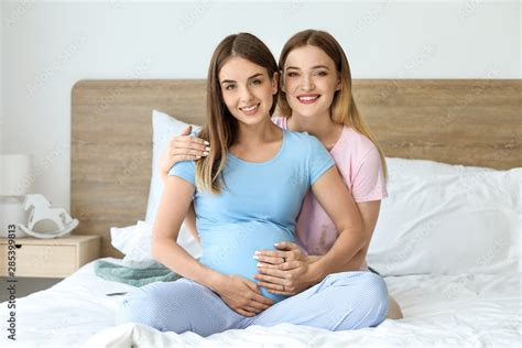 Cute <strong>pregnant lesbians</strong> love to lick each others pussies at home on the bed. . Pregnant lesbien porn